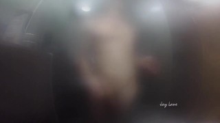 Twink jerks off and presses cock against glass in steamy shower session