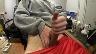 Jerking off in red shorts