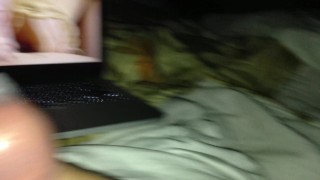 Watching porn jacking off into a condom next to my wife