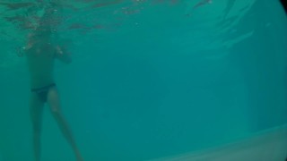 Underwater swimming with jockstrap in hotel pool
