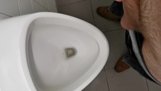 Horny uncut teen jerking and cumming at public school urinal
