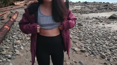 asian teen gives blowjob and flashes on public beach