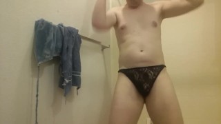 smooth twink-like bisexual gay man dances shakes hips in lace panties