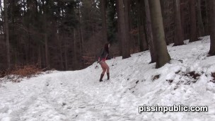 Girls in need skate around in the snow to find a proper place to have a pee