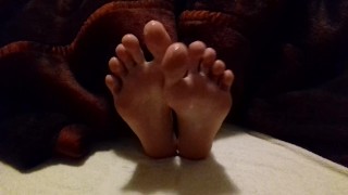 Lubed feet and soles rubbing each other - spreading toes