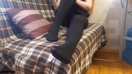 Girl in ebony pantyhose playing and teasing