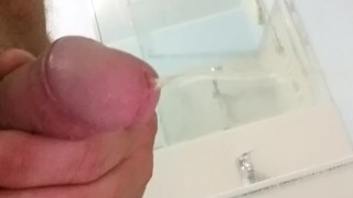 White cock piss into shower