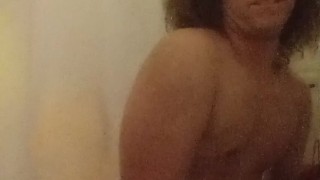 Fingering ass and stroking in shower