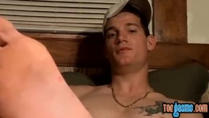 Inked jock Glock shows off feet and wanks for cumshot