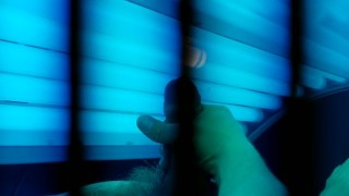 Watch me tense up as i cum on myself in this tanning bed