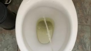Pissing at home in red and white socks