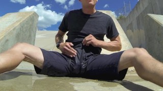 Pissing black athletic shorts in public and cumming inside them