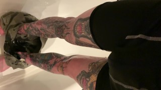 Tattooed guy desperate wetting taking off shorts and boxers