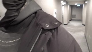 jerking off in hotel hall in wetsuit and trench coat