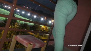 Desperation pee on public balcony when watch footballl game outdoor