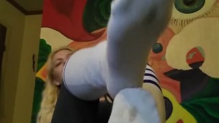 Hot blonde teases with socked feet and then tickles herself