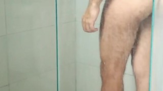 Spying a man taking a shower. What a beautiful ass!