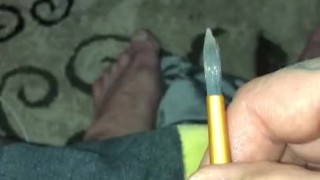 Trying to stuff little penis hole with paint brush