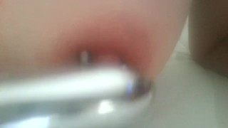 Play with my pierced nipples with silver vibrator