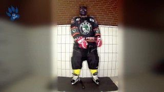 Rubber hockey pup pawing off