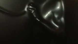 Slave encased in latex vacuum tower