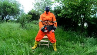 Riding dino toy in garden wearing hivis and rubber boots
