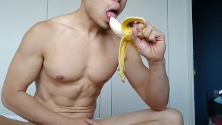 eating a banana - though not quite big enough for this flexing muscle hunk