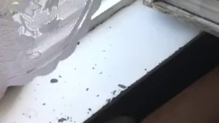 Russian boy jerking off in front of the window