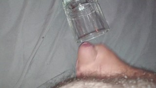 Solo masturbation cumshot into glass cup