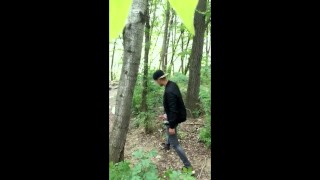 Bad boy jerks while smoking cigarette in a forest - almost caught - so his balls stay full