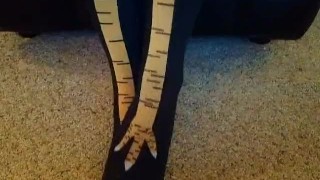 Becky putting on chicken socks