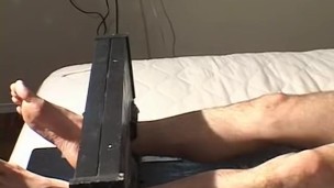 Foot fetish session with restrained stud and his naughty dom