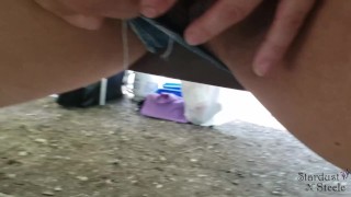 Horny wife teases her pussy under picnic table while camping outdoors