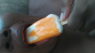 Sucking on a popsicle