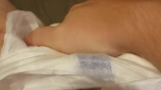 Playing with my freshly filled diaper