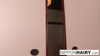 Japanese girl plays with her pussy while some boys peep