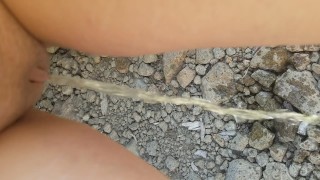 Desperation Pee Outside In River Rocks