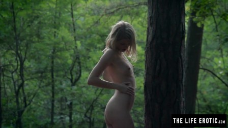 Skinny girl fucks herself hard in the forest