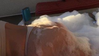 Curvy amateur too busy on her phone to notice she’s on camera.