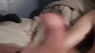with long hair strokes his big cock to huge load
