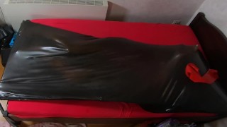 Rubberdoll get in Vacbed with gloves