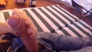 Russian teen masturbates his big cock in a campground while his friends are outside