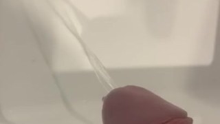 Solo guys takes huge piss in sink and plays with it