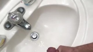 Hung guy jerks in bathroom