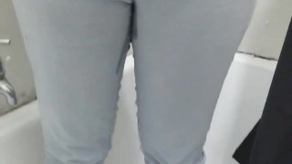 Busty girl pisses her pants