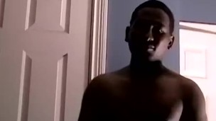 ebony amateur Dre watches porn while tugging his small cock
