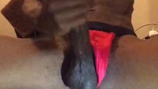 Stroking his dick in thong