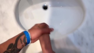 Quick hotel bathroom cumshot into sink in swim trunks while friend is gone