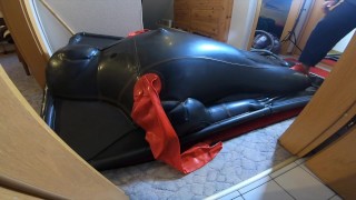 Doll play with inflated deflated drone in vacbed