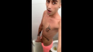 Twink shows cock in pink swim trunks then he masturbates at a waterpark